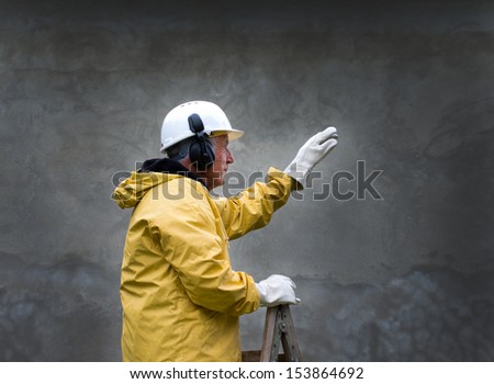Engineer in safety suit commands