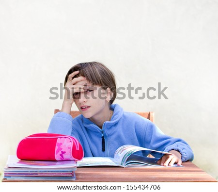 Girl is bored with homework