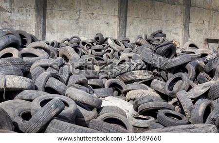 Pile of old used tires stocked for recycling
