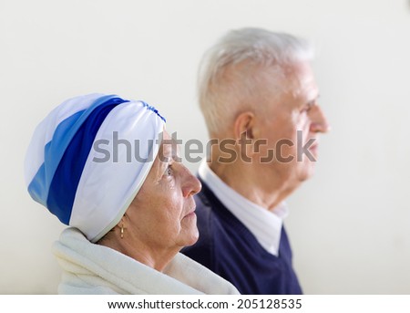Old woman and man expressing different emotions, profile photo