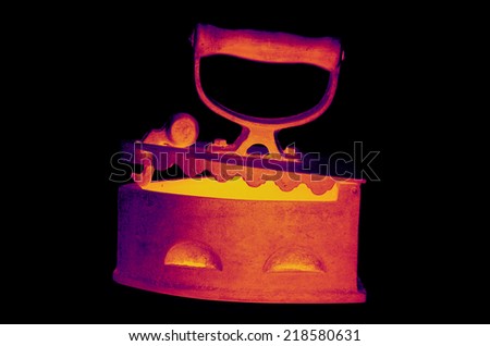 Red-hot iron in infrared light on black background
