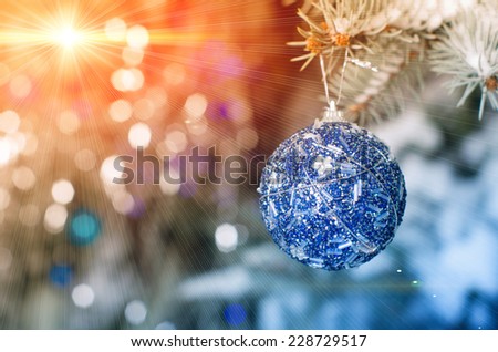 Blue christmas decoration ball hanging on tree