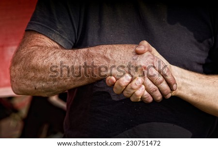 Close up of two male worker\'s hands making deal