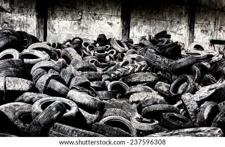 Pile of old used tires stocked for recycling