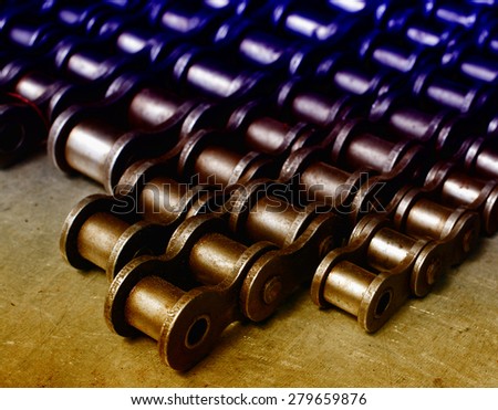 Metal link chains arranged in rows on the table