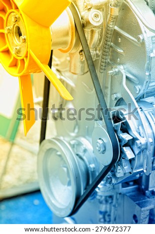 Close up of cooler and transmission belt on tractor engine