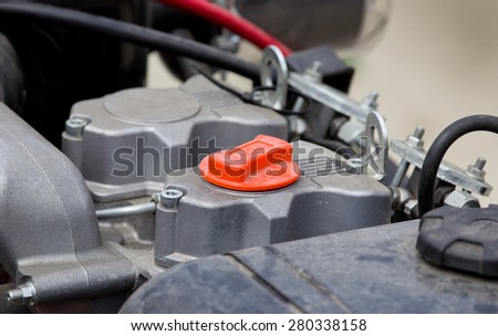 Close up of red oil reservoir on car engine