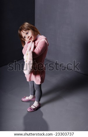 a child standing in the corner