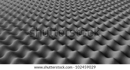A perspective view of grey sound proofing foam in a staggered pattern