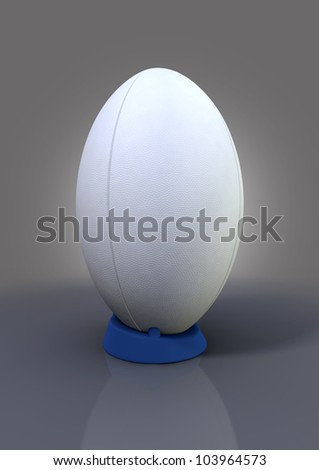 A plain white textured rugby ball on a blue kicking tee on a plain bacground