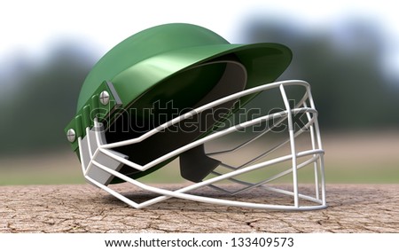 A regular green plastic cricket helmet on a cracked cricket pitch with white markings