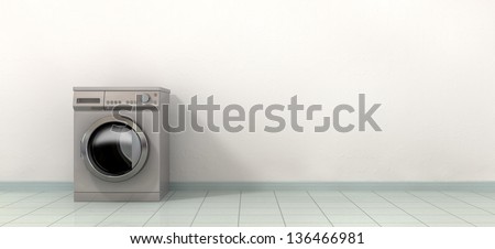 A front view of a regular brushed metal washing machine in an empty tiled room