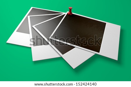 A perspective view of five fanned out blank instant photograph films pinned by e red push pin on a green background