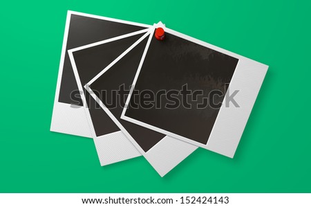A front view of five fanned out blank instant photograph films pinned by e red push pin on a green background