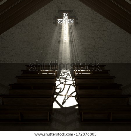 An old church interior with a stained glass window in the shape of a crucifix with a spotlight rays penetrating through it reflecting the image on the floor