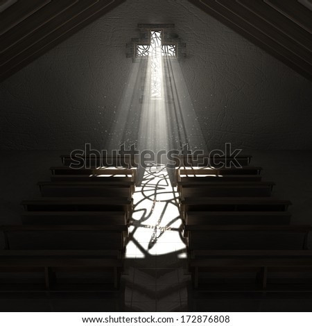 An old church interior with a stained glass window in the shape of a crucifix with a spotlight rays penetrating through it reflecting the image on the floor