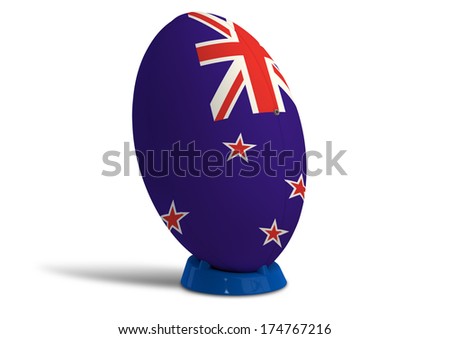 A textured rugby ball in the colors of the new zealand national flag on a kicking tee on a isolated white background