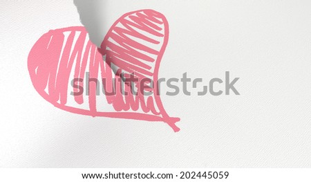 A white piece of paper tearing in two through a sketched pink heart