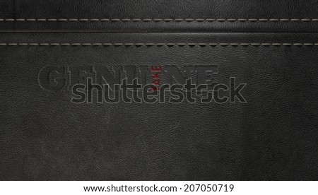 A concept image showing a regular stitched sheet of black leather with an embossed stamp reading genuine but the one letter reads the word fake