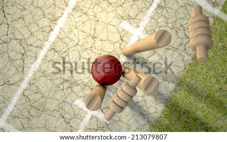 A red leather cricket ball hitting wooden cricket wickets on a grass cricket pitch background