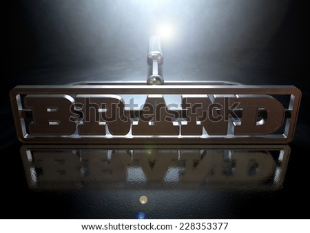 A metal cattle brand with the word brand as the marking area on an isolated dark backlit surface and background