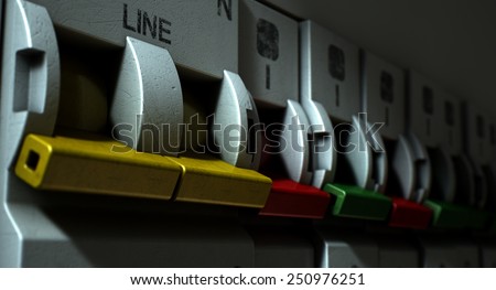 A row of switched off household electrical circuit breakers on a wall panel