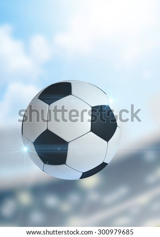 A regular soccer ball flying through the air on a stadium background during the daytime