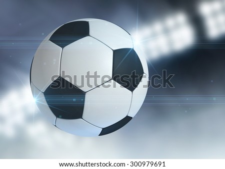 A regular soccer ball flying through the air on an indoor stadium background during the night