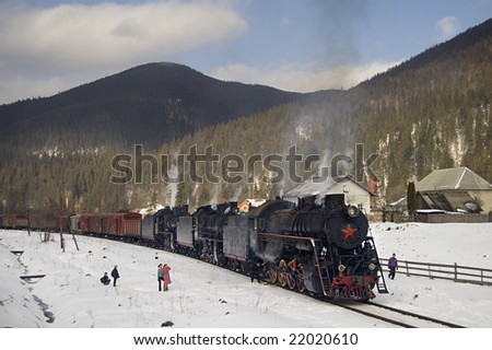 Freight train on the Retro Tour with steam locomotives (L, Em, Er) in the Carpathians at February of 2008.
