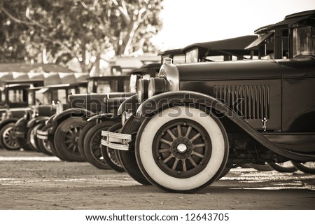 A line of old cars used in a movie shoot.