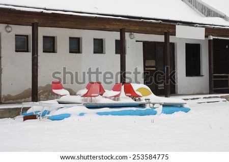 boats covered snow in winter