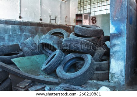 Old used tires,photo from demolition  textile  factory