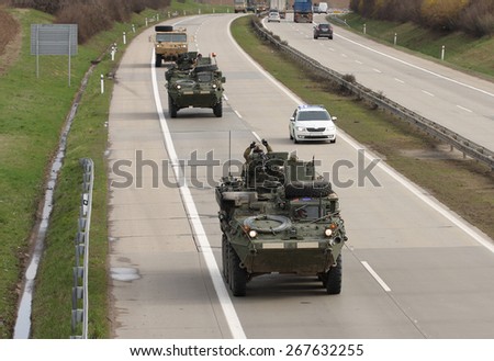 Strykers,wheeled armored vehicles drive on highway .The U.S. military convoy, returning from the Baltic countries to a German base, entered the territory of the Czech Republic