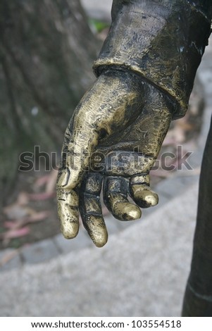 Golden hand, detail of a statue