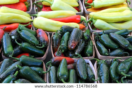 Jalapeno and banana peppers in baskets from farmer market