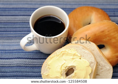 bagel with butter cream and coffee for breakfast