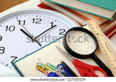 books, clock, and other school supply