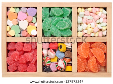 many kinds of fruit flavor candies in wooden box