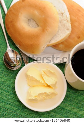 bagel with butter cream and coffee for breakfast