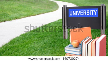 Education concept: the way to go to university with book