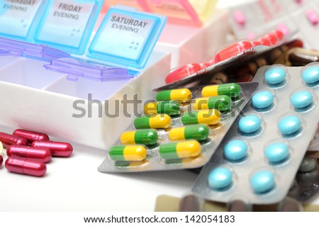 many medicine pills and plastic case
