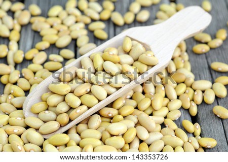 Peruvian Canary (Peruano) Beans  on grunge table