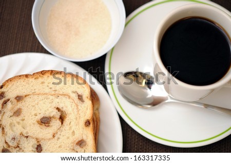 sliced raisin cinnamon and coffee for breakfast