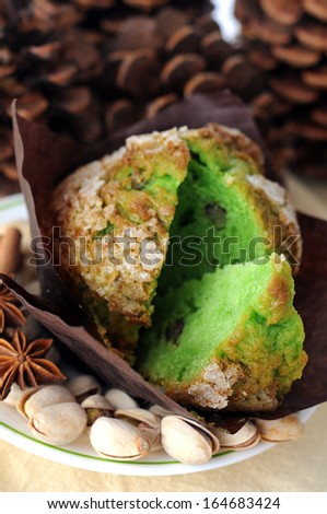 muffin and pistachio on napkin