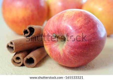 gala apple with cinnamon on table