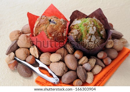 two muffins and nuts in hard shells