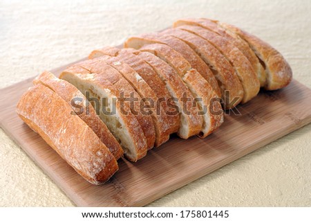 sliced ciabatta flat bread on cutting board
