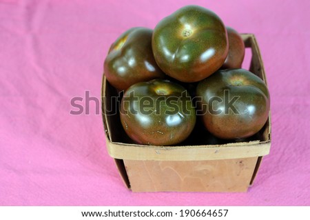 brown tomato with bucket on the table