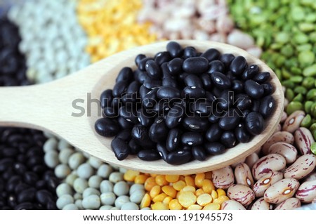 black bean in spoon and mix of bean