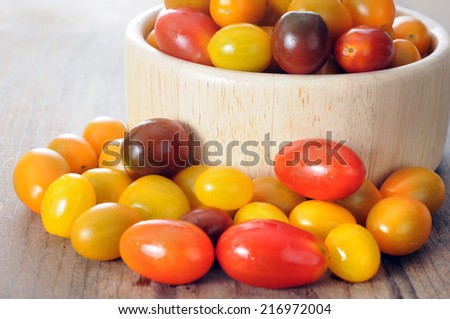 fresh and delicious grape tomato on rustic table